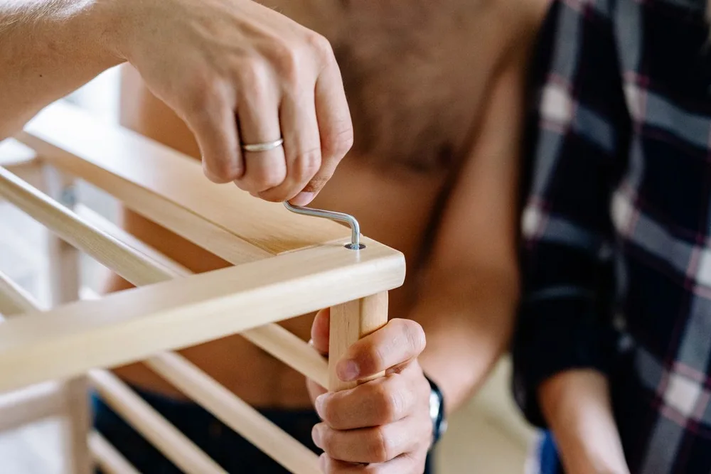 Close-up of wooden furniture being assembled